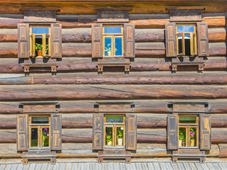 Windows on the Facade of a Wooden House