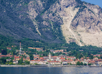 Fototapeta na wymiar Baveno, a tourist resort on Lake Maggiore and behind Mount Camoscio from which pink granite is extracted. Italy