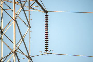 high voltage power lines on blue sky