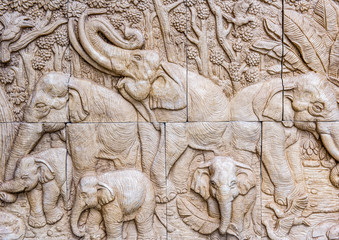 elephant family carve texture and wallpaper © angkhan