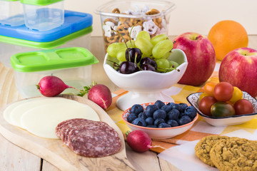 Preparation of school lunch.Cheese and salami and vegetables - ingredients for sandwiches.