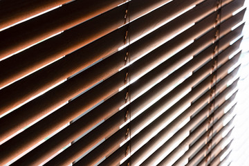 Close-up of brown blinds blocking sunlight