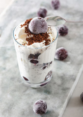 Ice cream with cherry berries on  marble countertop background
