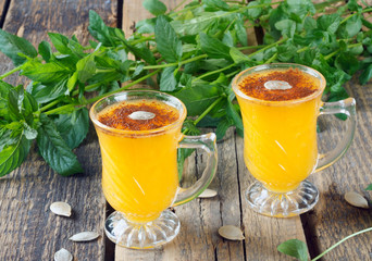 Healthy pumpkin fruit smoothie with seeds and mint leaves
