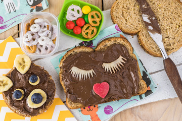 School lunch chocolate spread variety fruits sandwich for kids.