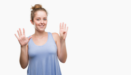 Young blonde woman showing and pointing up with fingers number nine while smiling confident and happy.