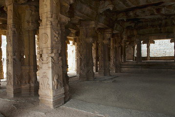 Carved pillars of the Kalyana Mandapa, Divine Marriage Hall, Achyuta Raya temple, Hampi, Karnataka. Sacred Center. Interior view from the north-east.