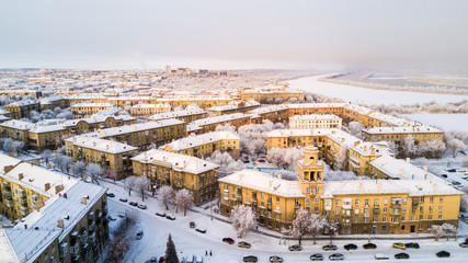 Drone photo of Magnitogorsk city in the winter evening, building of the fifties, Russia