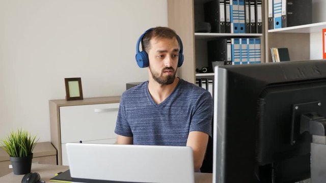 Man working as graphic designer in his modern office