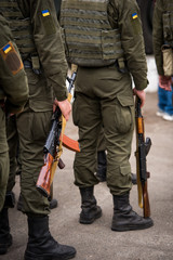 A Kalashnikov rifle in the hands of the military. War in Ukraine. Anti-terrorist operation in Ukraine. ATO in Ukraine. Armed forces.