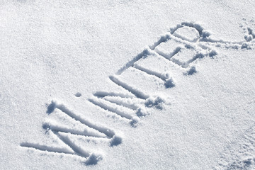 Winter. Hand drawn text on fresh snow