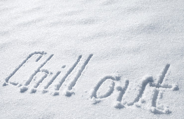 Chill out. Hand drawn text on snow