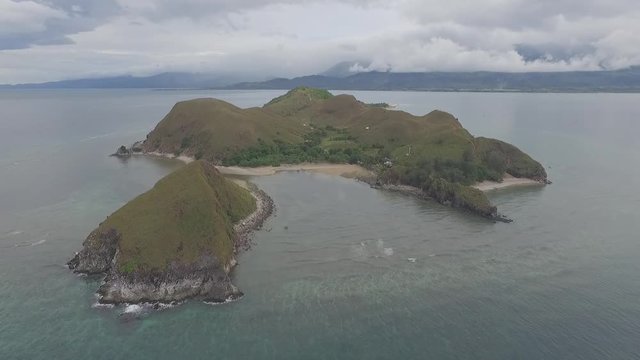Drone shot of tropical Mararison island during dramatic cloudy day. Philippines