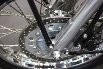 close up - wheel spokes and brake disc of a motorcycle