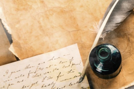 Feather pen into the inkwell