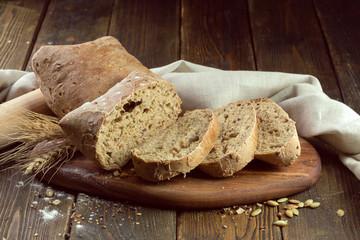 baked bread on wooden table background