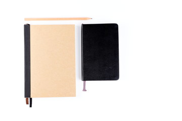 Top view cover note book with cream or natural color and leather black color with pencil placed on white background, space for letter type. Isolated , Copy space.
