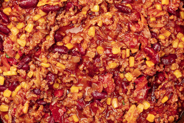 Chili con carne texture, overhead view, traditional Mexican dish