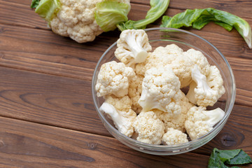 Organic cauliflower on wooden background