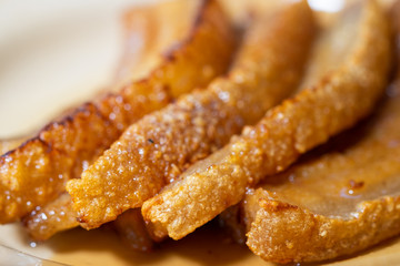 Crispy Pork Belly on wooden chopping board