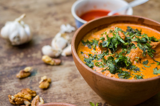 Harcho or Kharcho traditional Georgian soup food in Mingrelia with beef or chicken, rice, cherry plum pur&eacute;e and chopped walnut and decorated with fresh chopped coriander leaves. Georgia Samegrelo food