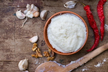 Gomi (mamaliga porridge) - popular dish from Samegrelo region made of white coarse cornmeal, butter and salt. Georgian traditional food.