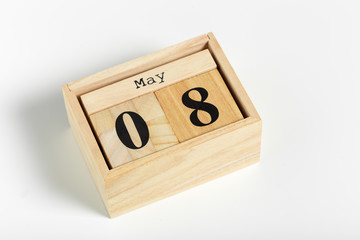 Wooden cubes with date on white background. 8th of May