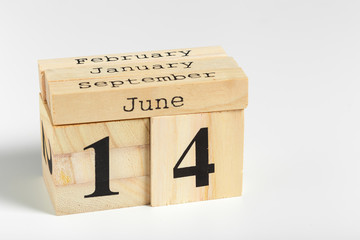 Wooden cubes with date on white background. 14th of June