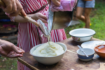 Elarji - from Samegrelo region, made from coarse cornmeal, cornflour and Suluguni cheese. Gomi cooked with cheese. Georgian traditional food - elardji. 