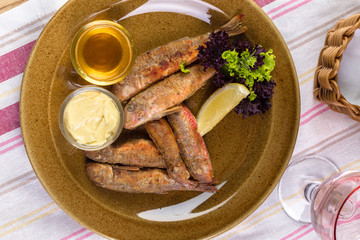 fish smelt fried in a plate. top view