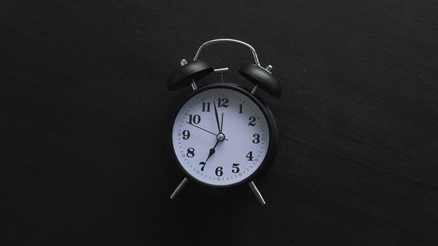 Alarm clock on dark black background