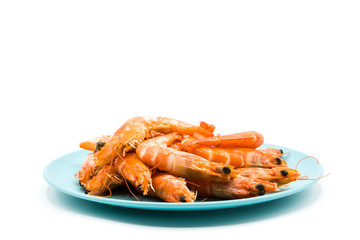 Grilled shrimps on blue plate isolated on white background

