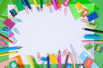 Flat lay of office and school stationery supplies. Set of colorful pens, sticky notes, notepads, pens, binderclips. top view. Back to school