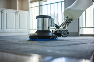 cleaning floor with machine