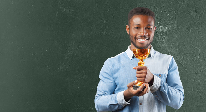 Business Black Man Holding A Trophy In His Hand