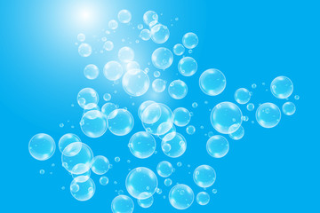 Realistic soap bubbles with rainbow reflection set isolated on the blue background.