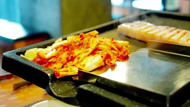 Full video HD from asian street food concept with vegetable grill on hot tray with during service worker support cook