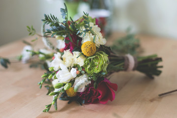 Amazing bridal bouquet with garden roses, carnations, freesias and greenery