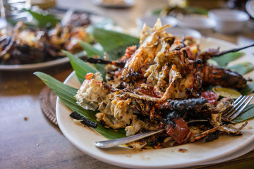 seafood plate in bali indonesia served on banana leaf