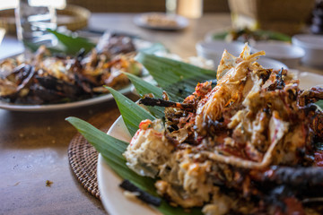 seafood plate in bali indonesia served on banana leaf