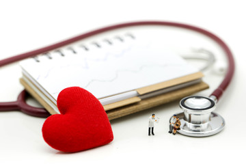 Miniature people : Doctor and patient Cardiogram with stethoscope and red heart,A heart beats graph...
