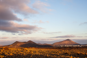 Fototapeta na wymiar Sunset over unique Lanzarote island landscape