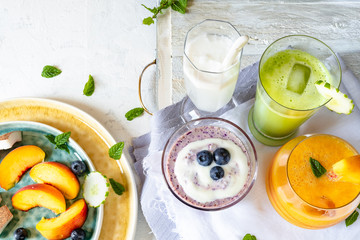 peach and melon smoothie, coconut smoothie, cucumber extract and blueberry milkshake. Close up