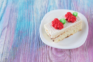 Tasty mini cake on a color gradient background
