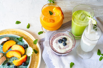 smoothies, vegetable extracts and fresh fruit, top view. Close up