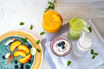 smoothies, vegetable extracts and fresh fruit, seen from above