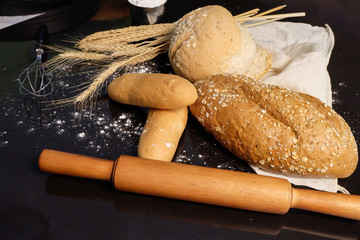 homemade bread on the kitchen table with dark background