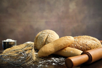 homemade bread on the kitchen table with dark background