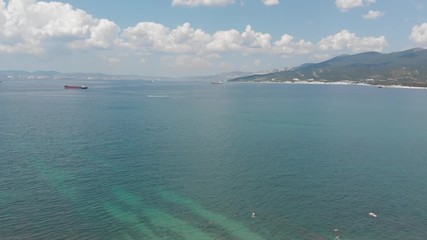 Aerial photography of the sea with boats and mountains