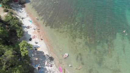 Aerial photography of the sea with boats and mountains